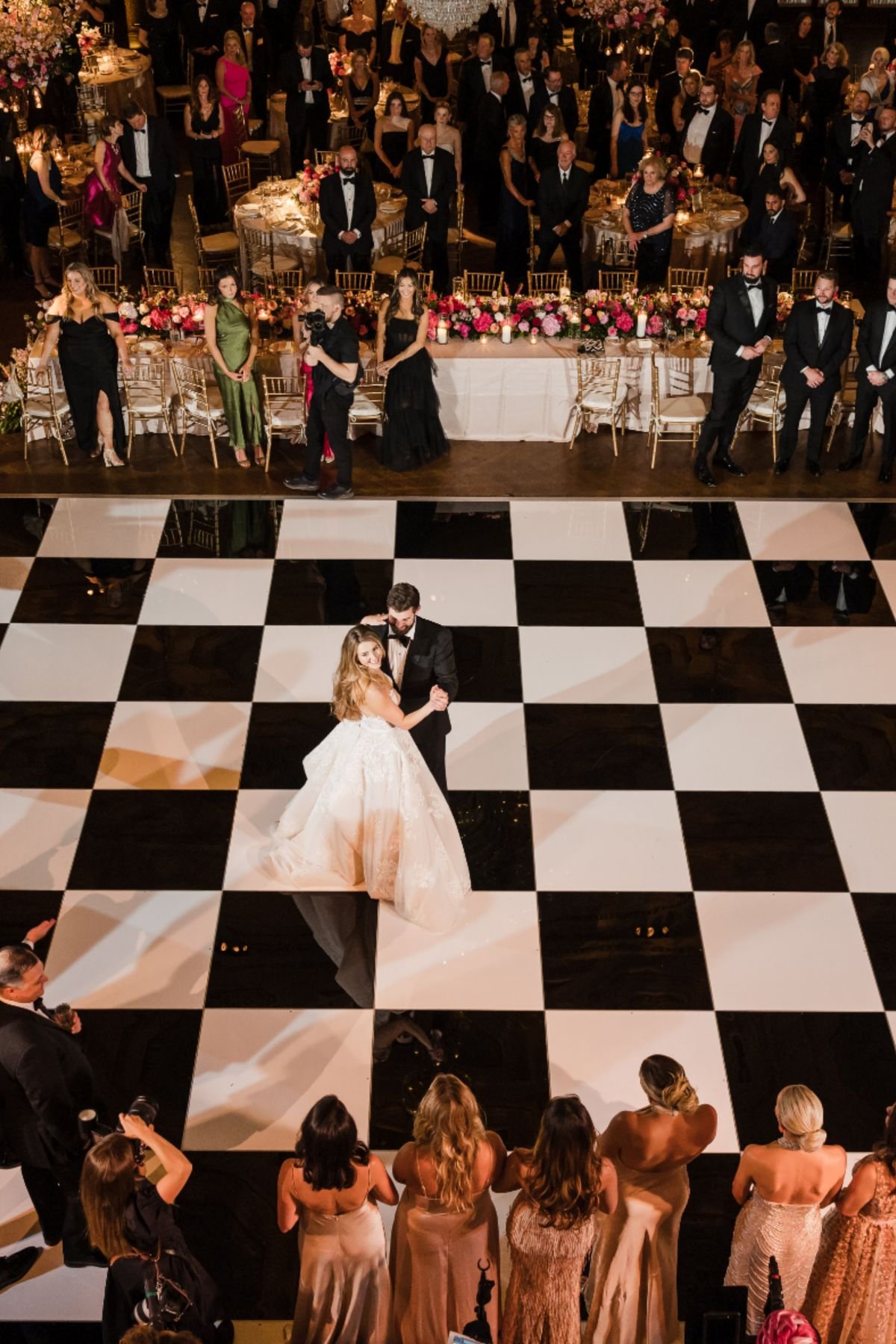 Black and white checkered dance floor rental set up for an Oklahoma City wedding reception, viewed from above